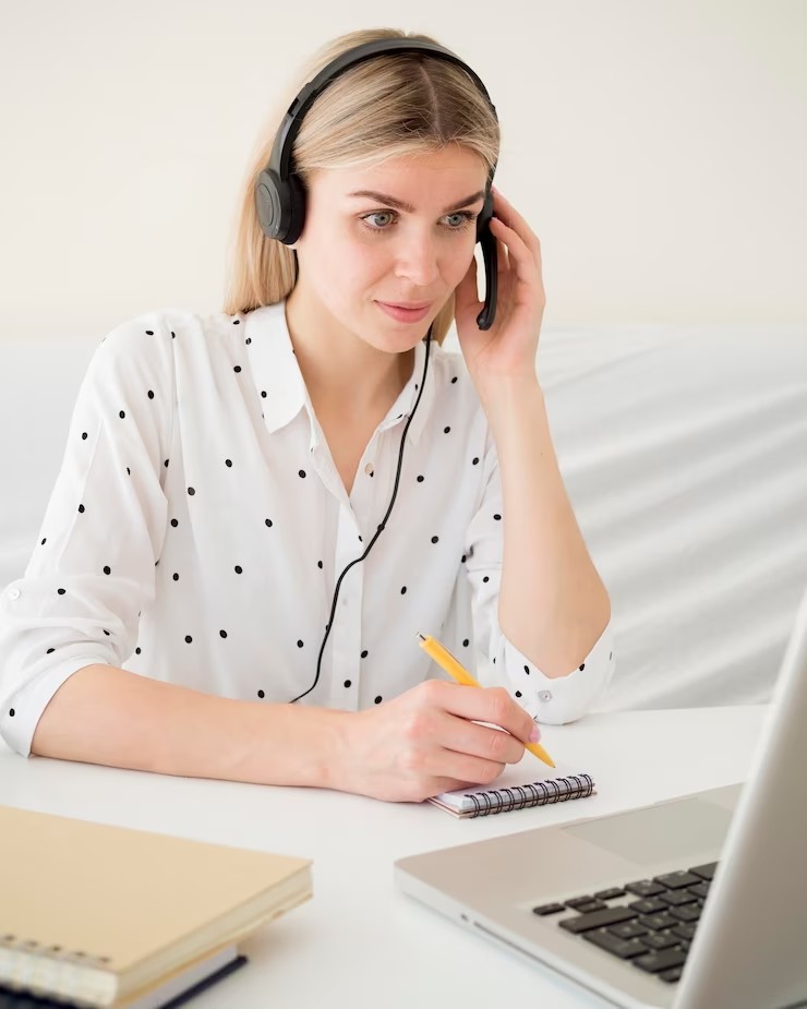 online-classes-with-student-holding-her-headphones_23-2148552191