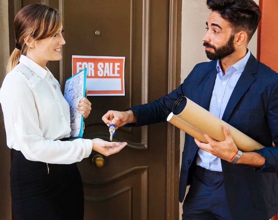 real-estate-agent-giving-key-business-woman_23-2147653343